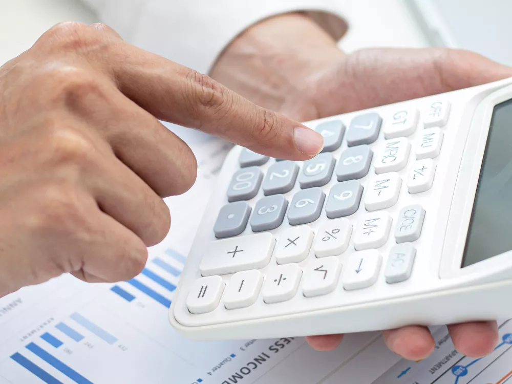 Une calculette évoquant les taxes américaines sur les produits suisses.